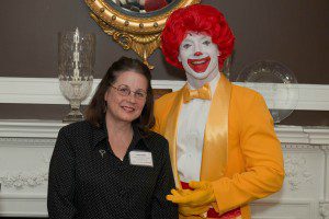 North Middle School English Language Arts Teacher Mary Madru receives the Ronald McDonald House Charities of Connecticut and Western Massachusetts Local Hero Award, which recognizes 10 outstanding area teachers each year. Joining her is Ronald McDonald. (Photo by Nick Caito)