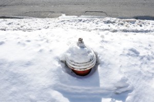 A fire hydrant remains buried on School Street Monday. (Photo by Frederick Gore)