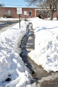 A small footpath in front of the Westfield State University dormitory Monday could be an obstacle to physically challenged residents. (Photo by Frederick Gore)