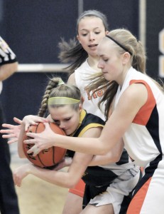 The South Hadley Tigers hounded Southwick all night. Here, Rams' Mackenzie Sullivan tries to protect the ball. (Photo by Frederick Gore)