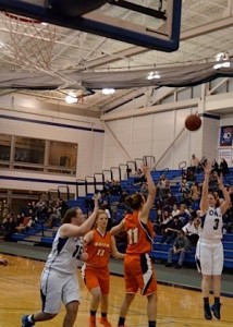 en Ashton drains a left wing jumper to score her 1,000th career point. (Photo by Mickey Curtis)
