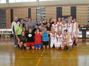 A total of 17 former Westfield high School girls’ basketball varsity players, and four coaches, recently participated in an alumni game at WHS. Alumni Jen Ferrari is missing from the photo. Coach Ralph Loos was instrumental in putting together the event. (Submitted photo)
