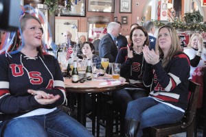 Lindsey Bellamy, front left, sister of Kacey Bellamy of the Woman's Olympic Hockey Team, joins family, friends, and fans at The Tavern Restaurant yesterday to watch the USA VS Canada game. (Photo by Frederick Gore)