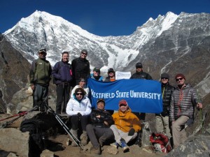 Westfield State students and professor pose on top of a 15,000 foot peak in Langtang, Nepal.  Back row from left to right: Saroj Rai, Alexandra Henry, Michaela Quimby, Chelsea Reynolds, Nick Stone, Anish Rai, Patrick Bartel, John Bartel. Front row from left to right: Shannon Grossman, Adrianne Stelmack, Palden Sherpa, Kevin Tatsugawa. (Photo submitted)