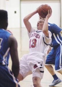 Westfield's Jacob Beman (13) attempts an off-balance move against West Springfield Monday night. (Photo by Chris Putz)
