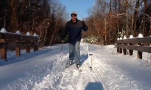 A cross-country skier enjoys some sun and snow on the Rail Trail in Southwick. (Photo by Dan Call)