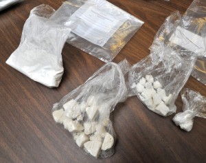 Large amounts of both powder and 'rock' cocaine, reportedly with a retail value of more than $16,000, were seized Friday in a raid of a Sackett Street drug house by city detectives. (Photo by Carl E. Hartdegen)  