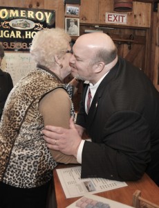 State Sen. Donald Humason Jr., receives a hug and kiss from Pomeroy Sugar House greeter Rosalie Pike, during a Legislative Breakfast sponsored by Humason Friday. Humason was joined by more than a dozen local and state dignitaries. (Photo by Frederick Gore)