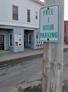 One-hour parking is allowed on the west side of School Street as indicated by numerous signs located along the roadway. (Photo by Frederick Gore)