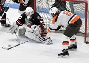 Westfield goalie Garrett Mathews prepares to make a save against Agawam's Seamus Curran during the 2013-14 Western Massachusetts D3 championship at the Olympia in West Springfield. Matthews and the Bombers are preparing for another strong run from the Brownies this season. (Photo by Frederick Gore)