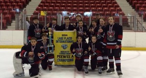 The PeeWee A team celebrates a championship at the Lake Placid Tournament on March 2. (Submitted photo) 