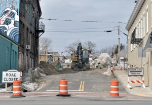 Heavy equipment and supplies are staged at the Pochassic Street Bridge as contractors prepare to resume work on the bridge shortly. The $2.7 million renovation project is scheduled to be completed in June 2014. (Photo by Frederick Gore)