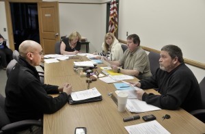 Southwick Department of Public Works Director Randy Brown, left, explains a pavement management program to members of the Board of Selectmen during last night's meeting at Town Hall. (Photo by Frederick Gore)