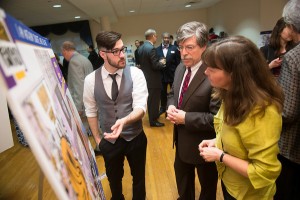 Student Anthony Duarte, ’14 of Granby, Mass., discusses his art work with gala guests, glass artist Josh Simpson and astronaut Cady Coleman. More than $2,000 was raised at the gala to kick-start the Josh Simpson and Cady Coleman Scholarship for Science & Art Education. (Photo by David Harris-Fried)