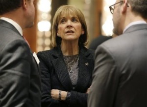 Massachusetts Attorney General Martha Coakley speaks to two men after addressing a breakfast meeting of the Greater Boston Chamber of Commerce at a hotel in Boston in January. Coakley, a Democrat, is seeking the governor's office in the 2014 election. (AP Photo/Steven Senne)