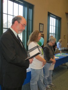 The Rev. Bart Cochran leads a group gathered to commemorate Donate Life Month at Southwick Town Hall last week in a prayer. (Photo by Hope E. Tremblay) 