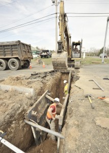 Contractors continue to install a new sewer line yesterday as commuters through North and Southampton roads contend with a temporary detour through local business establishments at that intersection. (Photo by Frederick Gore)