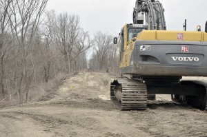Heavy equipment can be seen clearing brush and debris along the Columbia Greenway Rail Trail last month. (Photo by Frederick Gore)