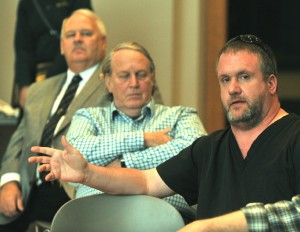 Brett Anderson of Southwick asks a question of Mass Wildlife officials about efforts to protect a wildlife habitat in the town at a meeting last night in Southwick Town Hall. (Photo by Carl E. Hartdegen)