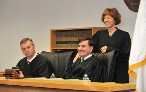 Judge Maureen Walsh, the first justice of Holyoke District Court, get a laugh from her friend and colleague, Judge Philip A. Contant, as she tells a story about the first justice of Westfield District Court at a celebration in his court room Wednesday of his 30th anniversary as a  judge. (Photo by Carl E. Hartdegen)