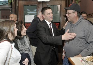 Westfield State Rep. elect John Velis, center, is congratulated by Ralph Figy, right, moments after his win over Republican candidate Dan Allie. Velis celebrated his victory party at the Tavern Restaurant in Westfield. (Photo by Frederick Gore)