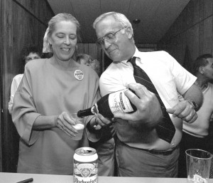 Bill Harmon pours champagne for Cele Hahn in 1994 to celebrate her election to the Massachusetts Great and General Court. (File Photo by Carl E. Hartdeegen)