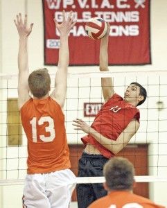 Westfield's Manny Golob, rear, tips the ball as Agawam senior Benjamin Cassidy, foreground, sets up for the block. (Photo by Frederick Gore/www.thewestfieldnews.smugmug.com)