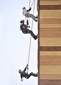 Westfield Fire Department Captain's Rebecca Boutin, bottom, and Chuck Warren, center, and Holyoke firefighter Mike Boucher, top, repel from the roof of University Hall on the campus of Westfield State University yesterday as part of a training exercise for the Western Massachusetts Technical Rescue team. Boutin and Warren are part of the recently formed response team that includes approximately 35 firefighters from across the area. Partial funding for the team was provided by the Western Regional Homeland Security Advisory Council. (Photo by Frederick Gore)