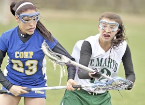 St. Mary midfielder Miranda Arena, right, battles for a loose ball during Tuesday's game against Chicopee Comp at Boardman Field. (Photo by Frederick Gore/www.thewestfieldnews.smugmug.com)