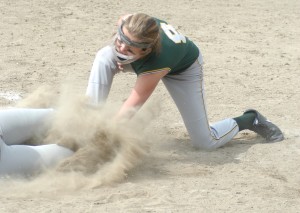 Rams' pitcher Emily Lachtara attempts to apply the tag amidst a cloud of dust on a Central baserunner sliding into home plate. The Golden Eagle player was safe. (Photo by Chris Putz)