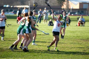 The Westfield and Minnechaug High School girls' lacrosse teams battle Monday in the Whip City. (Photo by Chris Putz)