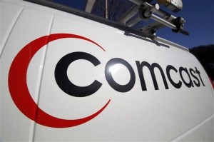 Comcast plans to sell some cable systems to competitor Charter Communications Inc., to help Comcast’s acquisition of Time Warner Cable clear regulatory hurdles. (AP Photo/Gene J. Puskar, File)