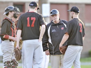 Westfield coach Rich Discenza, rear right, meets with the team during a timeout during a 2014 regular season game. (Staff photo)