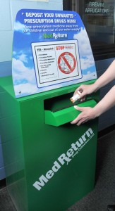 A resident uses the  MedReturn box recently installed in the Westfield Police Departmetn lobby to allow residents to safely dispose of unneeded prescription drugs. (Photo by Carl E. Hartdegen) Departemtn lobby 