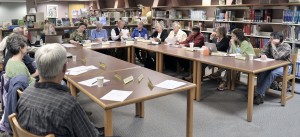 Members of the Gateway Regional School District listen as Superintendent Dr. David B. Hopson, seated center, provided an update on the school's technology. Hopson reported that the district is in an experimentation stage which could phase out the Apple computers that are presently in use. (Photo by Frederick Gore)