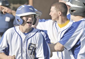 Gateway Regional's Everett Warner, left, is all smiles after scoring the game-winning run in the seventh inning. (Photo by Frederick Gore/www.thewestfieldnews.smugmug.com)