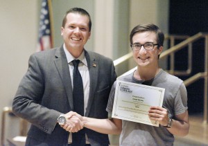State Rep. Nicholas Boldyga, left, presented a $500 scholarship to Southwick High School senior Joseph Mendes during the Southwick Dollars for Scholars Scholarship Awards Ceremony at the Southwick Town Hall Monday. (Photo by Frederick Gore)