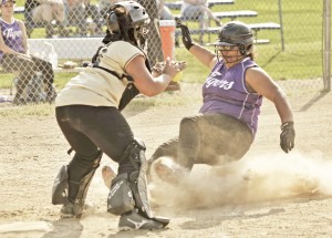 Westfield Voc-Tech's Johanna Valazquez, right, attempts to beat the tag of the Dean Tech catcher during Wednesday's game at Whitney Field. Westfield Voc-Tech went on to win 25-0 in a mercy ruling. (Photo by Frederick Gore/www.thewestfieldnews.smugmug.com)