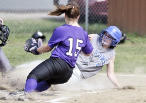 Gateway's Jessie Walton, background, beats the tag at home during yesterday's game against Smith Academy. (Photo by Frederick Gore)