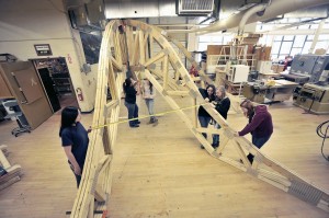 A group of students in the carpentry class at Westfield Vocational-Technical High School apply the finishing touches to the structural frame of the cupola that will be located on the City Green. (Photo by Frederick Gore)