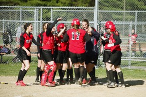 Westfield left fielder Annalise Eak is mobbed by teammates after crushing a three-run homerun over the left field wall. (Submitted photo)