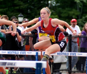 Westfield High School's Morgan Sanders clears the hurdle in the 100-meter event Saturday during the Western Massachusetts Track & Field Championships at Westfield State University. (Photo by Chris Putz)