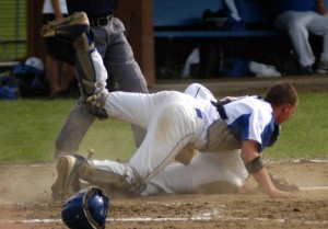 A collision occurs at home plate during the Gateway-St. Mary high school baseball game Monday in Huntington. (Photo by Chris Putz)