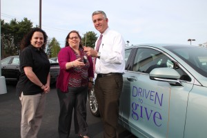 Sarat Ford Lincoln General Manager Jeffrey Sarat hands over the keys to a Driven To Give vehicle to Janine Iacola and Jennifer Ducharme of Relay For Life. For every person who tests drives a Lincoln from 3 p.m. - midnight tonight at the Agawam Methodist Church today, Lincoln will donate $20-$30 to the Relay For Life of Agawam.