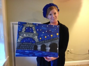Alecia Byrem, Director of Community Relations at Armbrook Village, shows off her creation, "An Evening In Paris" while wearing her French beret. (Photo submitted)