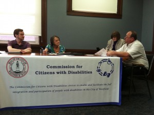 Commissioners Michael Reinhagen, Chair Madeline Nicoletti, Andrea Pianka, and Norman Smith discuss the Elm Street's handicapped parking availability last naight. (Photo: Peter Francis)