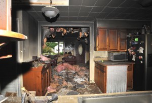 The kitchen, and beyond it the living room, of a house at 372 Montgomery Road displays limited damage after a fire Tuesday. (Photo by Carl E. Hartdegen)