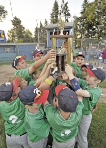 Members of the Sons of Erin team hold up the City Cup after defeating the Moose Club during Monday night's Westfield Little League City Cup championship at the Ralph E. Sanville Memorial Field on Cross Street. The Sons of Erin won 8-6. (Photo by Frederick Gore/www.thewestfieldnews.smugmug.com)