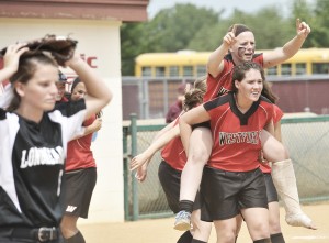 Westfield's Kaitlyn Puza, right, carries her teammate Julianne Sharon on the field after Westfield defeated Longmeadow, left, during the WMass D1 Final at the UMass Softball Complex, Sunday. Westfield went on to win 1-0. (Photo by Frederick Gore/www/thewestfieldnews.smugmug.com)