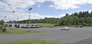 A large section of the Southwick Department of Public Works parking lot would be fenced but the public and town employees could still access the DPW garage building through the current entrance and exit. The fence would be located on the west side of the front trees, left, and continue the length of the paved lot which would protect the vehicles. (Photo by Frederick Gore)